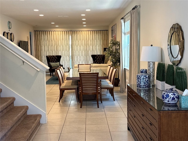 dining space with stairway, light tile patterned flooring, and recessed lighting