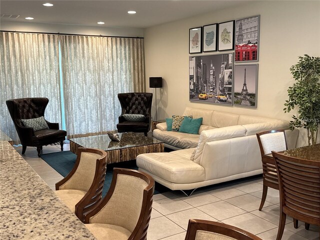 living room featuring recessed lighting, visible vents, and light tile patterned flooring
