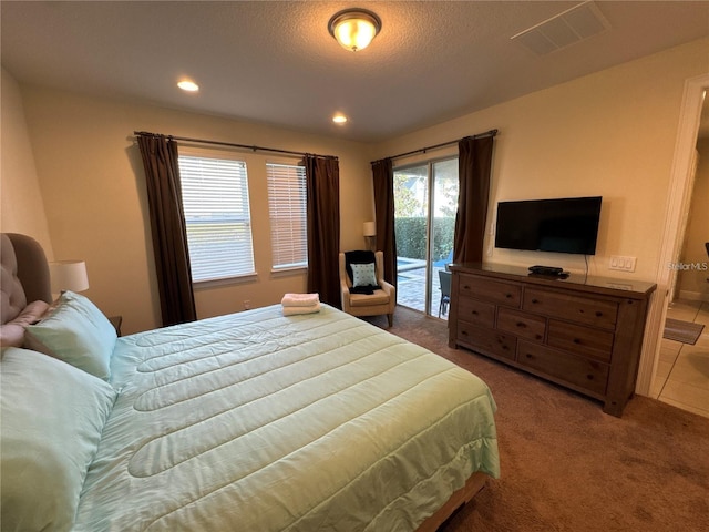 bedroom with access to exterior, carpet floors, recessed lighting, visible vents, and a textured ceiling