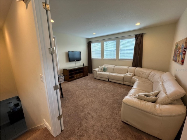 living area featuring carpet and recessed lighting