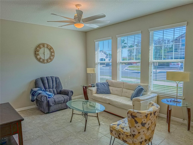3593 Brighton Park Cir, Belle Isle, FL 32812 - living room with ceiling fan, a textured ceiling, baseboards, and a healthy amount of sunlight