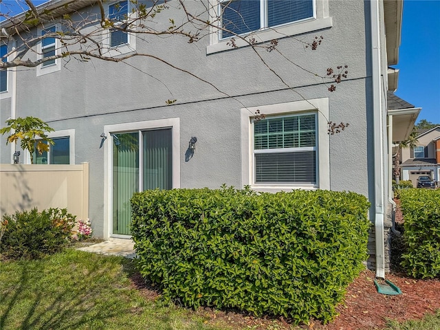 3593 Brighton Park Cir, Belle Isle, FL 32812 - view of exterior entry featuring fence and stucco siding