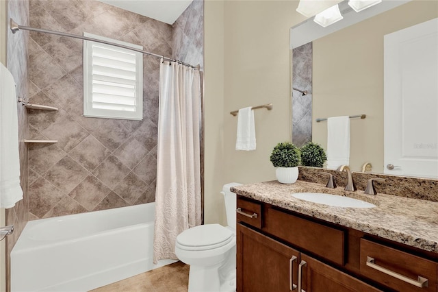 bathroom with toilet, vanity, and shower / tub combo