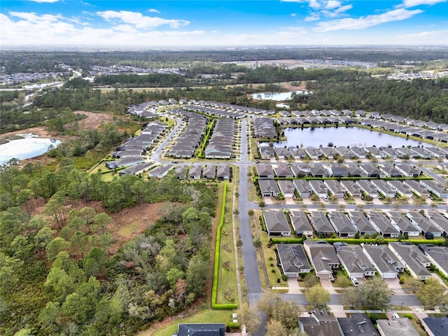 aerial view with a residential view and a water view