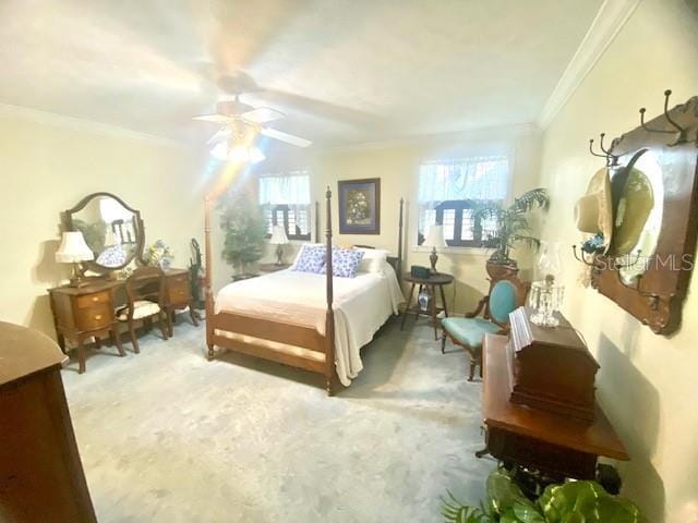 bedroom with multiple windows, a ceiling fan, carpet, and ornamental molding