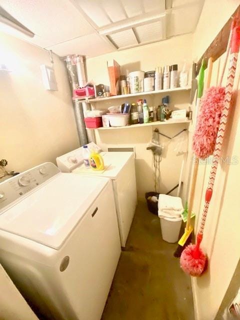 washroom featuring washer and dryer and laundry area