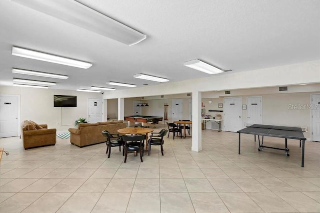 dining area featuring visible vents and light tile patterned flooring