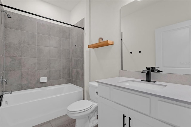 bathroom featuring shower / washtub combination, vanity, toilet, and tile patterned floors