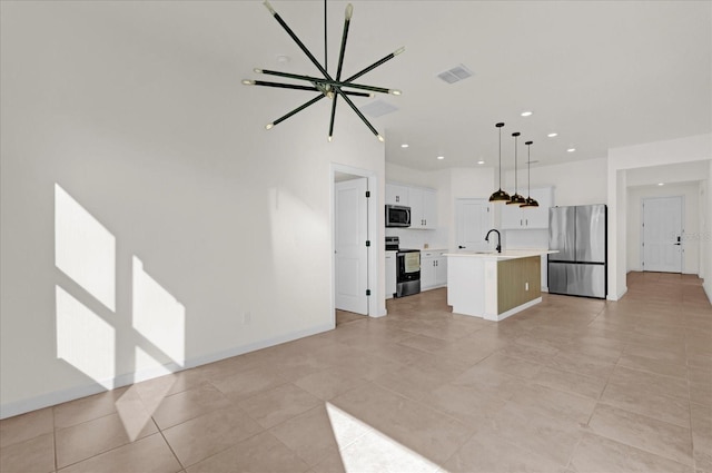 unfurnished living room featuring baseboards, visible vents, a sink, and recessed lighting