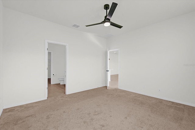 unfurnished bedroom featuring carpet floors, baseboards, visible vents, and connected bathroom