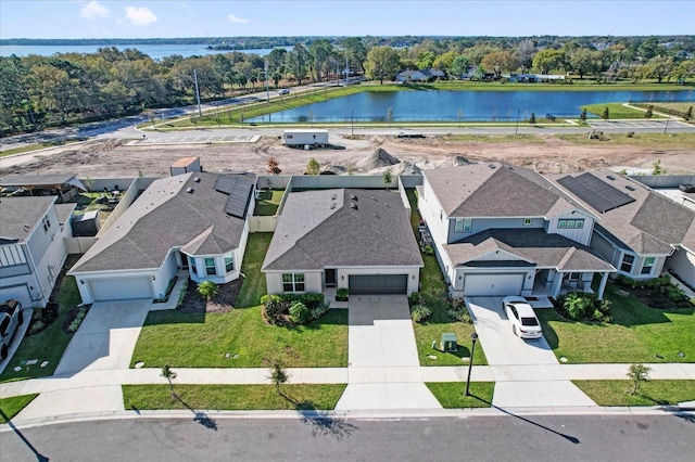 aerial view with a water view and a residential view