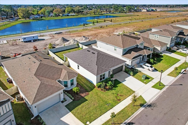 bird's eye view with a water view and a residential view