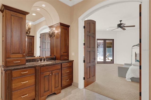 bathroom with recessed lighting, french doors, ornamental molding, and vanity