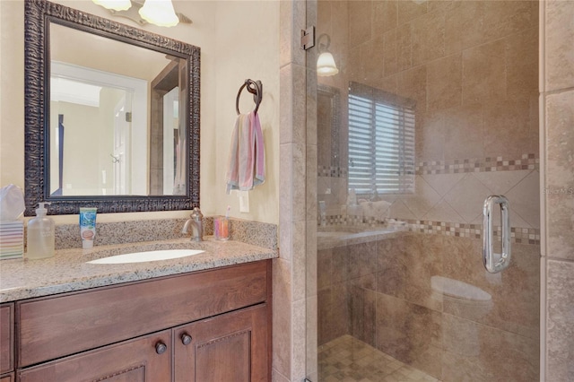 bathroom with vanity and a stall shower