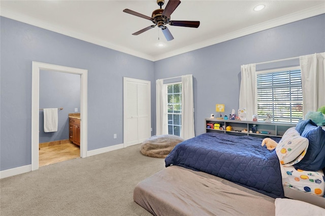 bedroom featuring crown molding, multiple windows, baseboards, and carpet floors