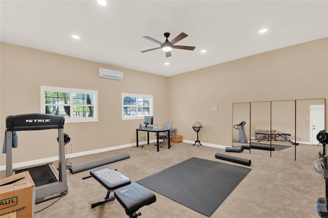 workout area with an AC wall unit, recessed lighting, carpet, and baseboards