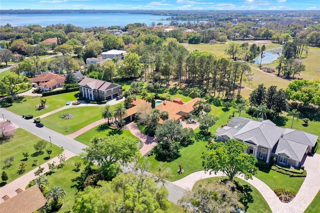 bird's eye view with a water view and a residential view