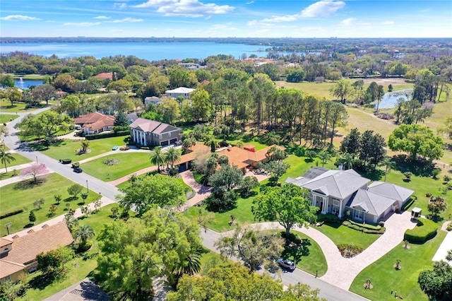 drone / aerial view featuring a residential view and a water view