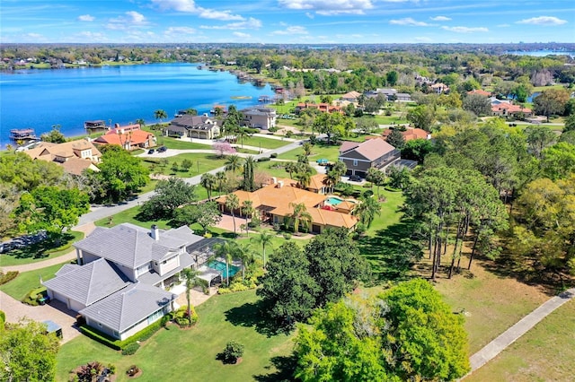 birds eye view of property featuring a water view and a residential view