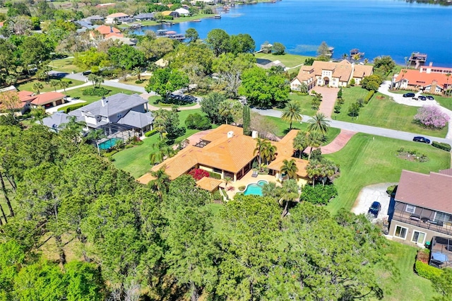 bird's eye view with a residential view and a water view