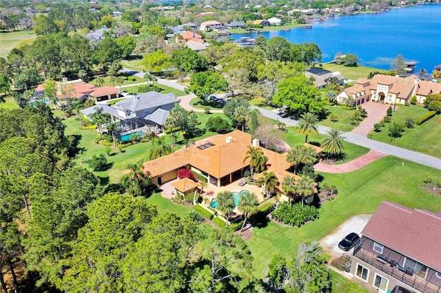 birds eye view of property with a residential view and a water view