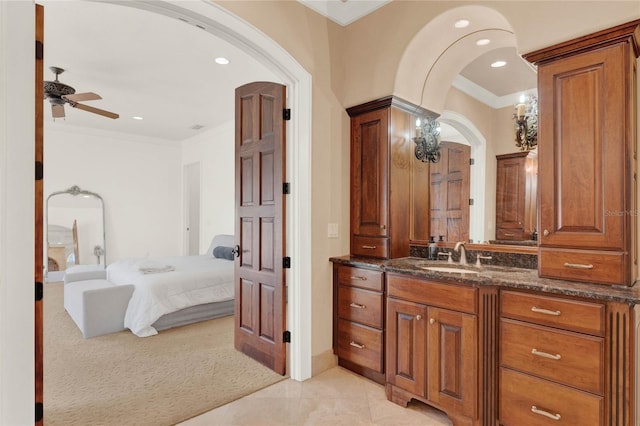 bathroom with vanity, crown molding, recessed lighting, and connected bathroom