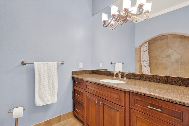 full bathroom with a chandelier, tiled shower, ornamental molding, and vanity