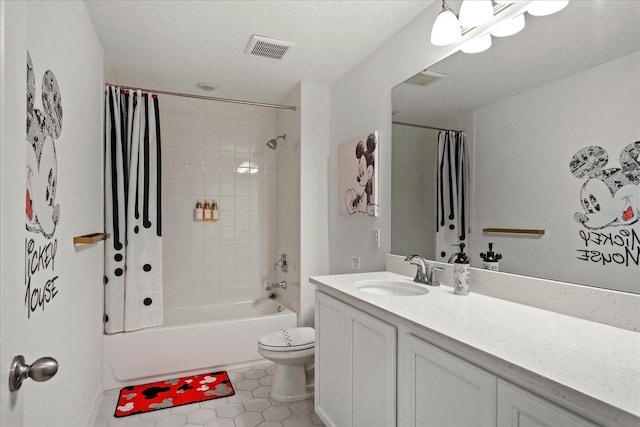 full bathroom with vanity, visible vents, shower / bath combo, tile patterned flooring, and toilet