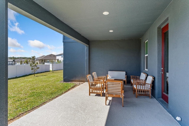 view of patio with fence and an outdoor hangout area