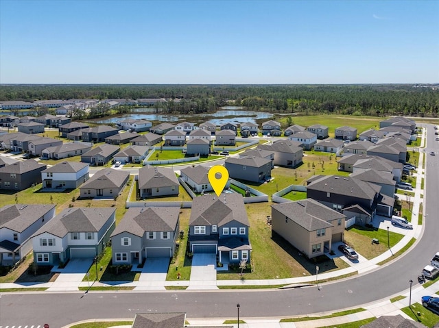 birds eye view of property featuring a residential view and a water view