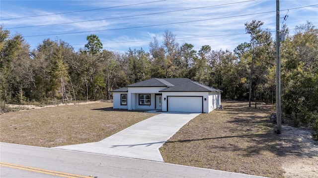 view of front of house with a garage, driveway, a shingled roof, and stucco siding