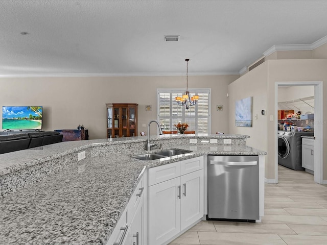 kitchen with washer / dryer, a sink, white cabinets, dishwasher, and a chandelier