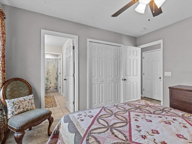 bedroom with light tile patterned floors, a ceiling fan, a closet, and connected bathroom