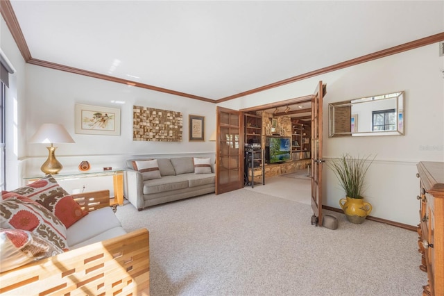 carpeted living area with baseboards and crown molding