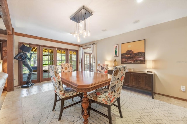 dining room featuring light tile patterned floors and baseboards