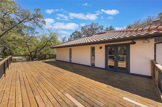 wooden deck featuring french doors