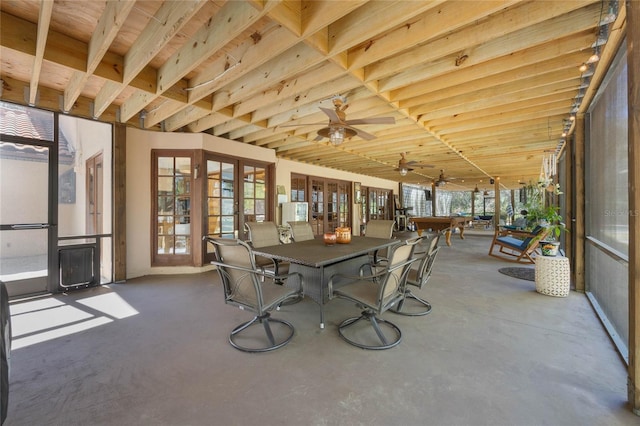 unfurnished sunroom with french doors and ceiling fan