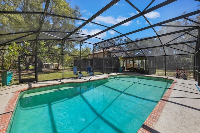 pool with a lanai and a patio