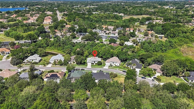 bird's eye view featuring a residential view and a water view