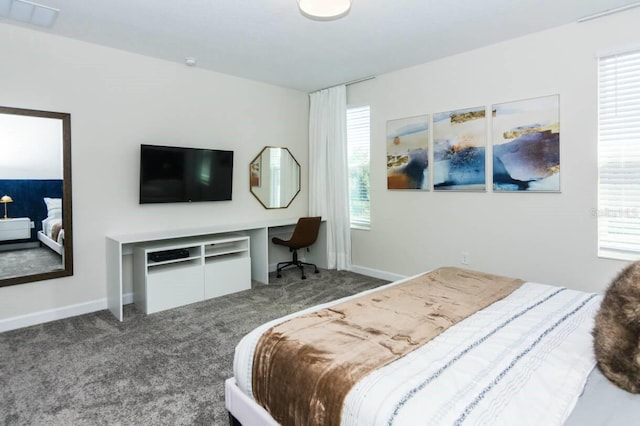 bedroom with carpet, multiple windows, visible vents, and baseboards