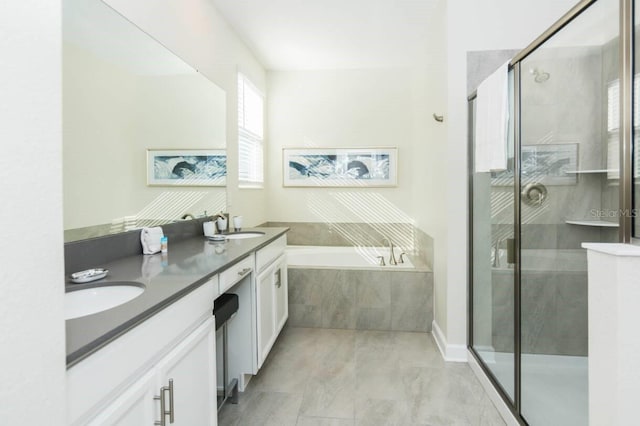 full bath featuring a stall shower, a garden tub, a sink, and double vanity