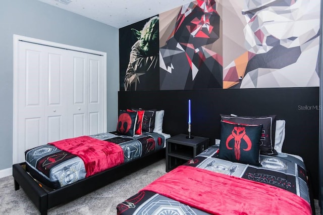 carpeted bedroom featuring a closet