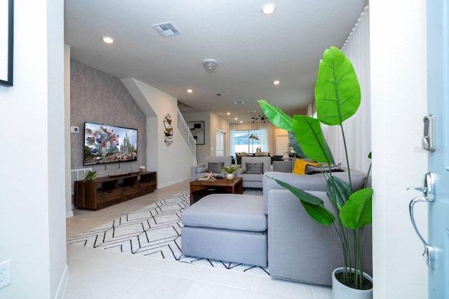 living area with recessed lighting, visible vents, baseboards, and tile patterned floors