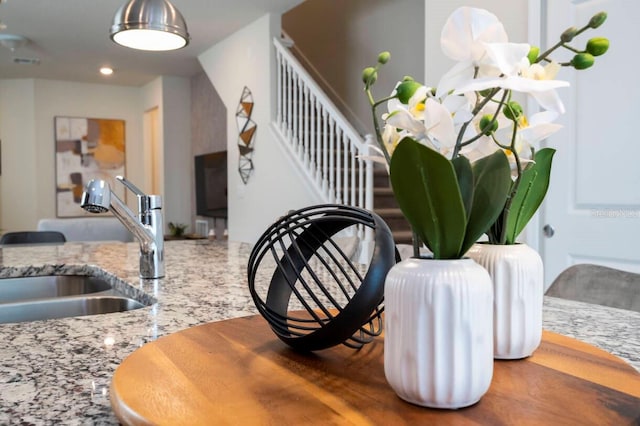 dining space featuring stairs