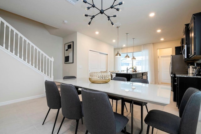 dining area featuring baseboards, visible vents, stairway, and recessed lighting