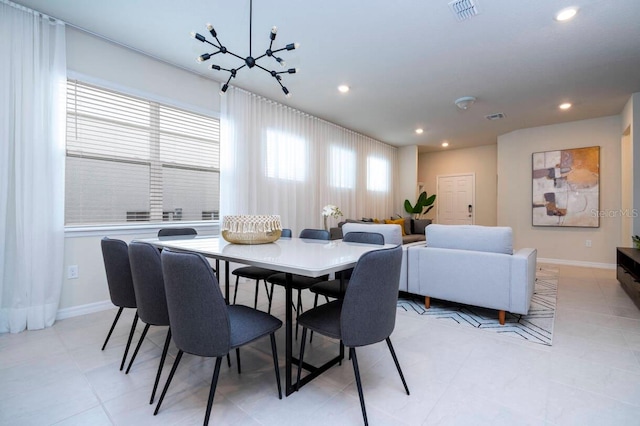 dining area featuring a chandelier, recessed lighting, visible vents, and baseboards