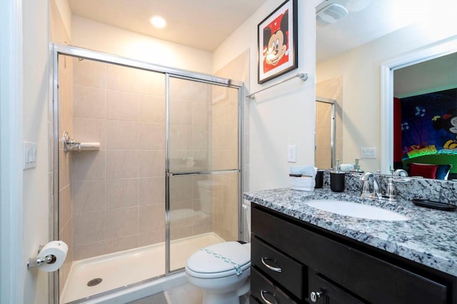 full bath with toilet, a shower stall, and vanity