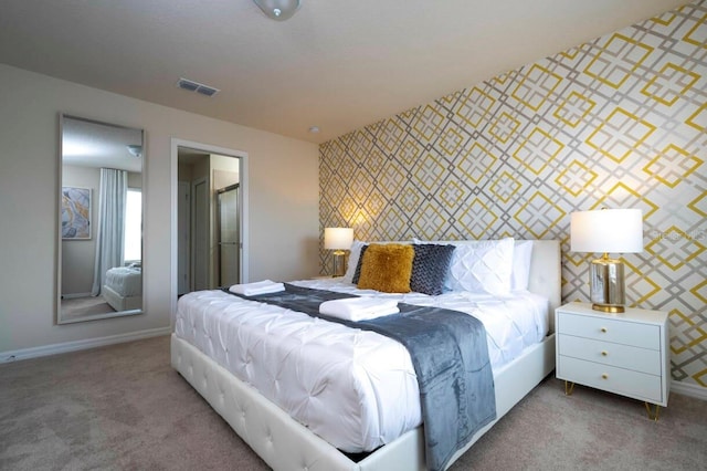 bedroom featuring carpet flooring, visible vents, and wallpapered walls