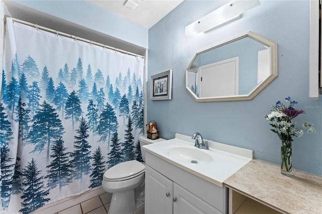 bathroom with tile patterned flooring, toilet, vanity, and a shower with curtain