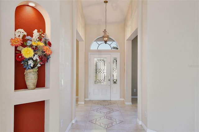 entryway featuring light tile patterned floors and baseboards